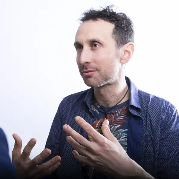 Portrait of Gabriel Lechemin in the middle of a conversation